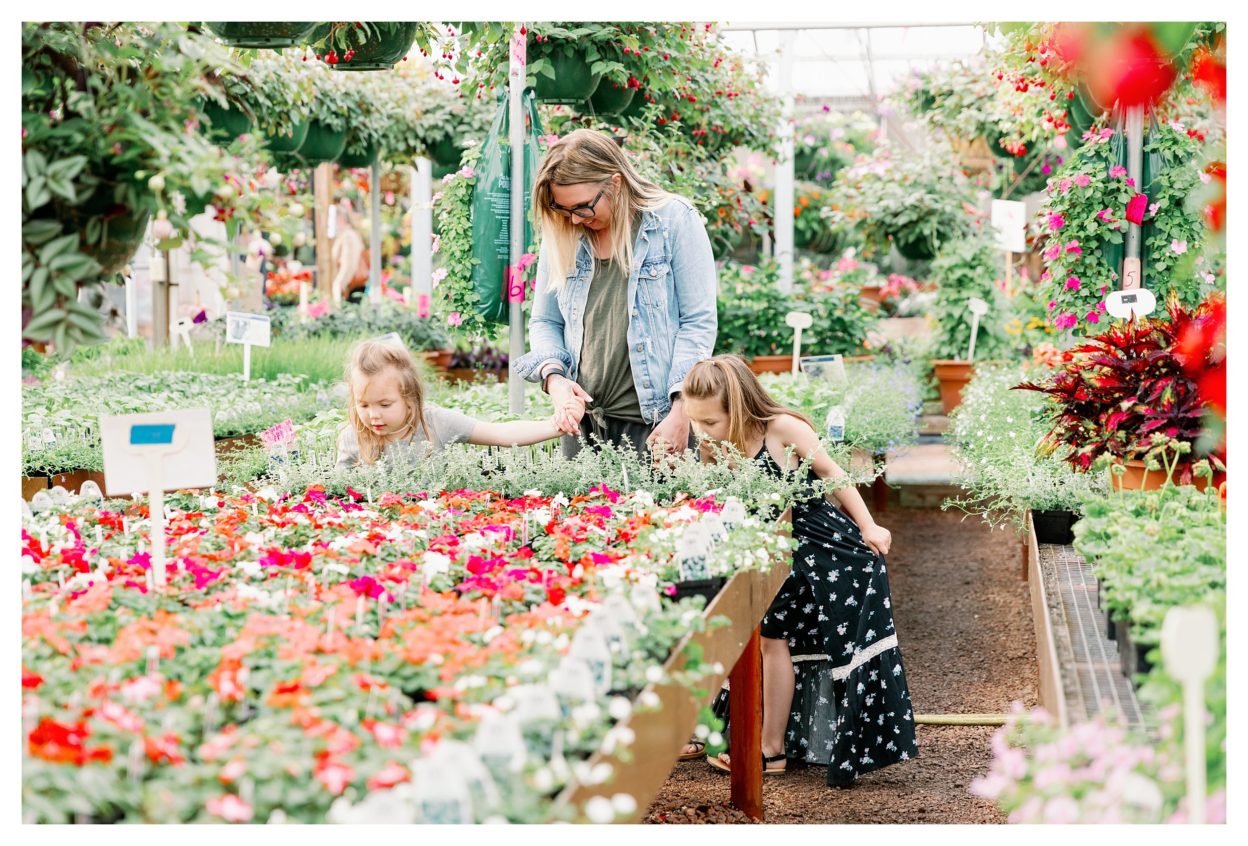 mom and kids pose in greenhouse at Rib Mountain Greenhouse