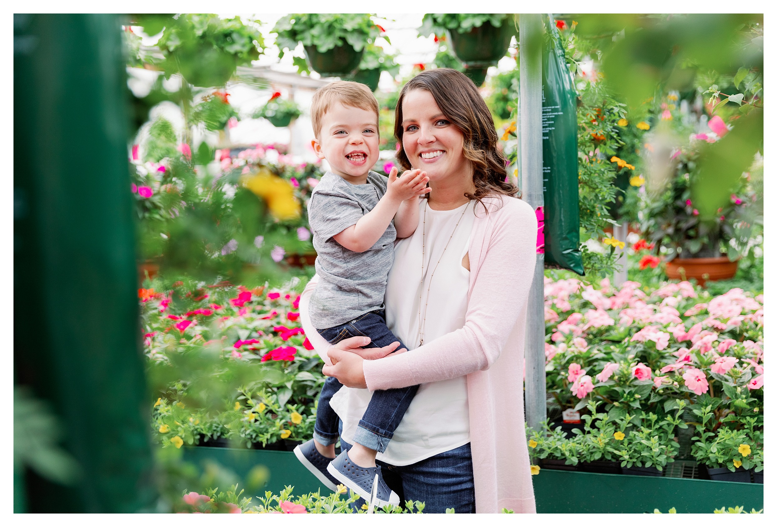 mom and toddler pose in greenhouse at Rib Mountain Greenhouse
