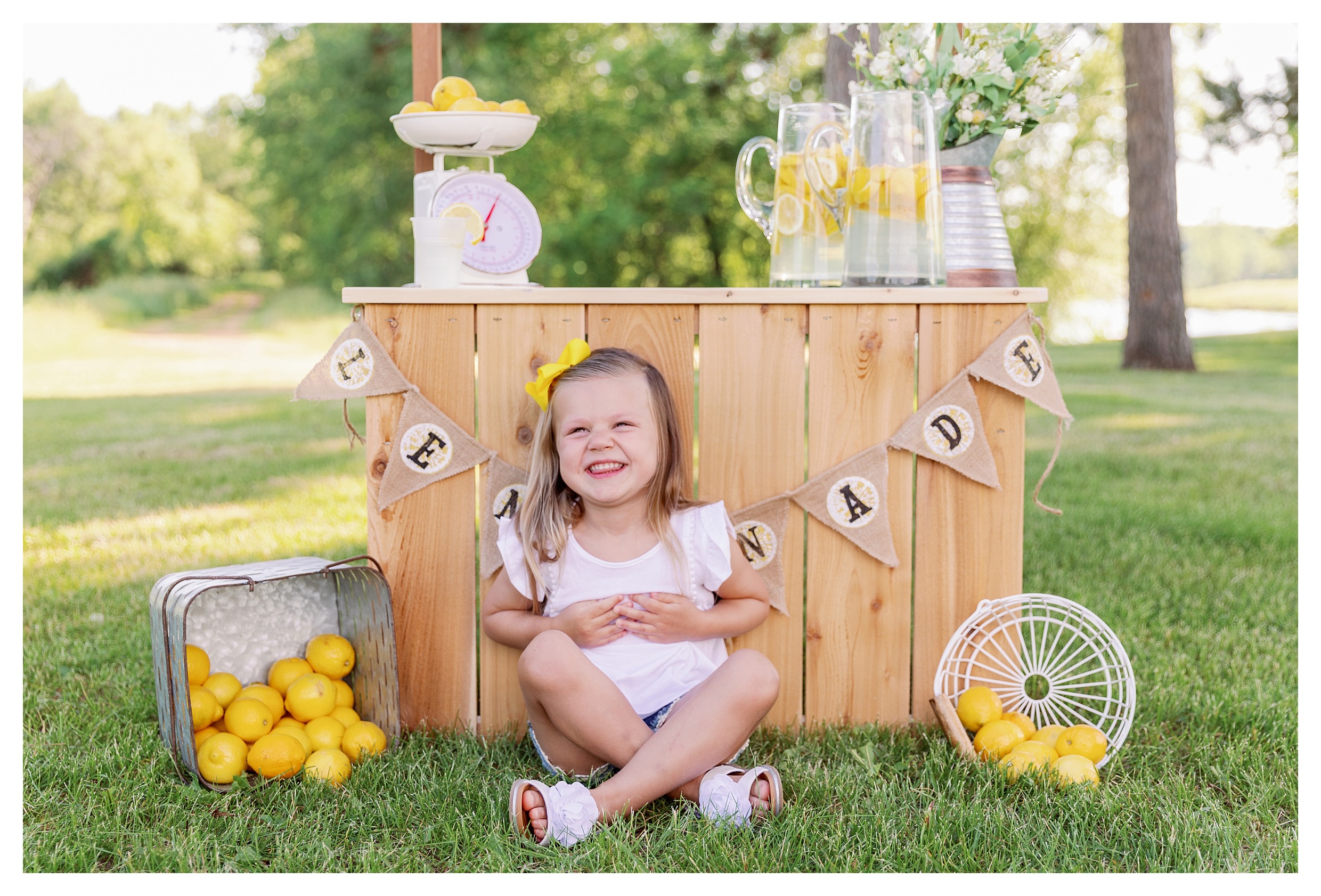 girl giggles hard at her lemonade mini session at Sunnyvale Park in Wausau, WI 
