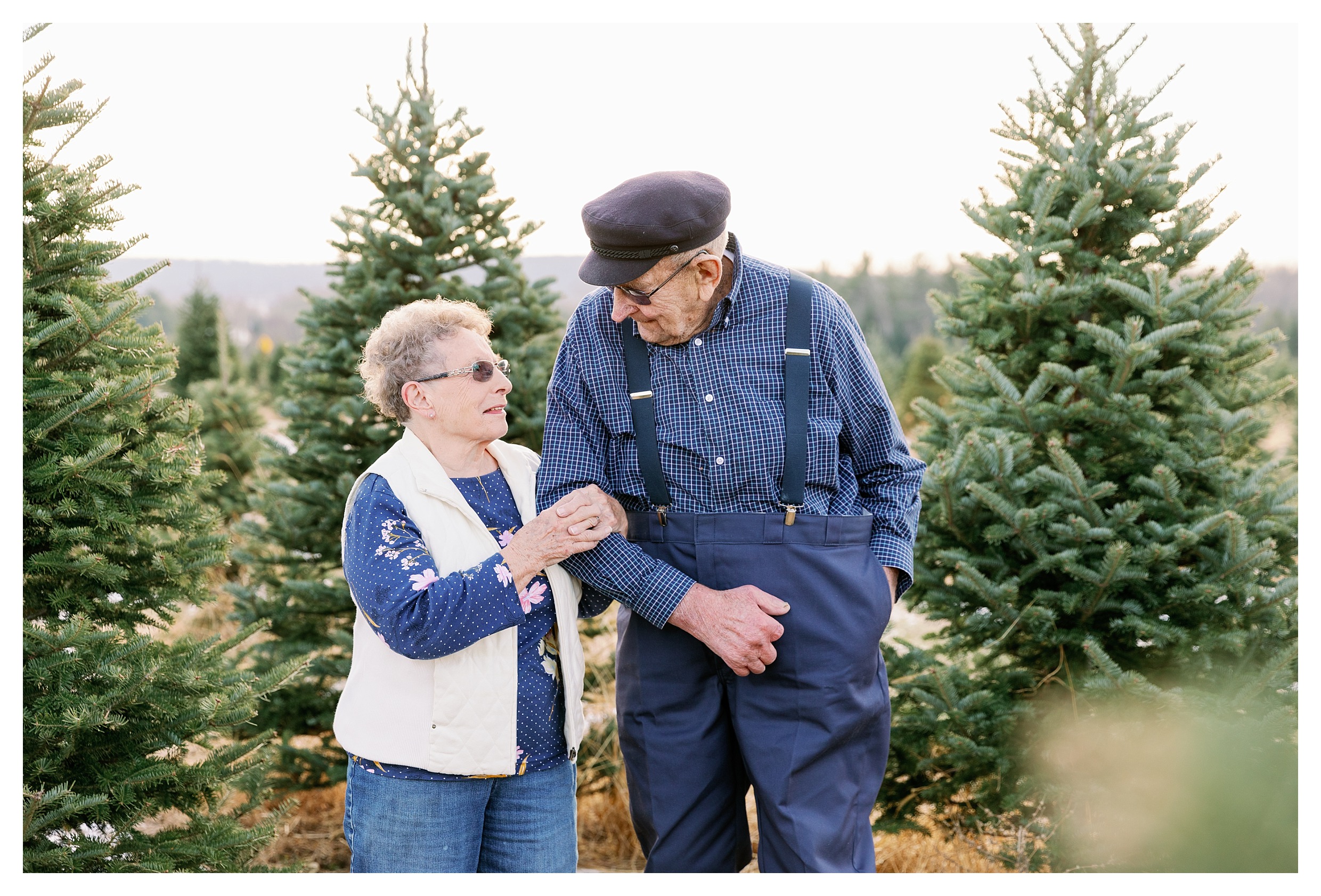 Grandma and grandpa at tree farm in Wausau for Christmas mini session